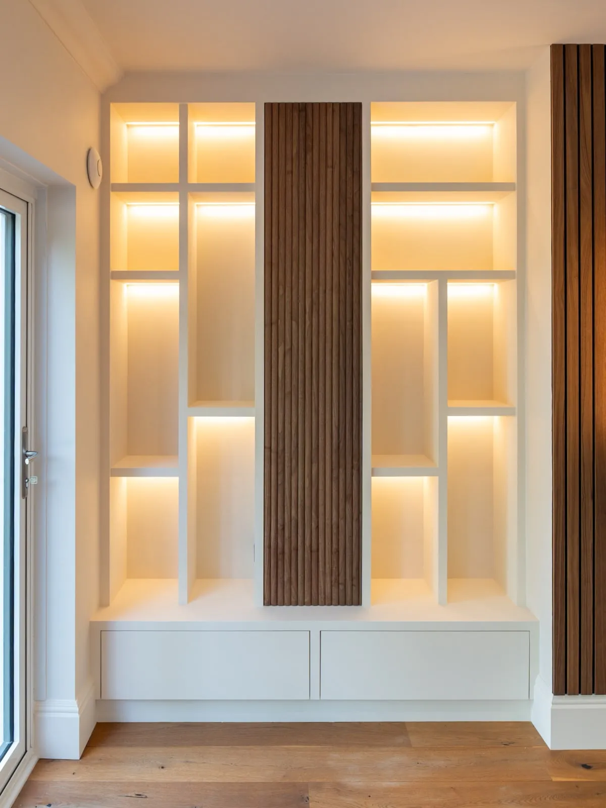 Backlit alcove shelving with walnut slat panel, Leighton Buzzard