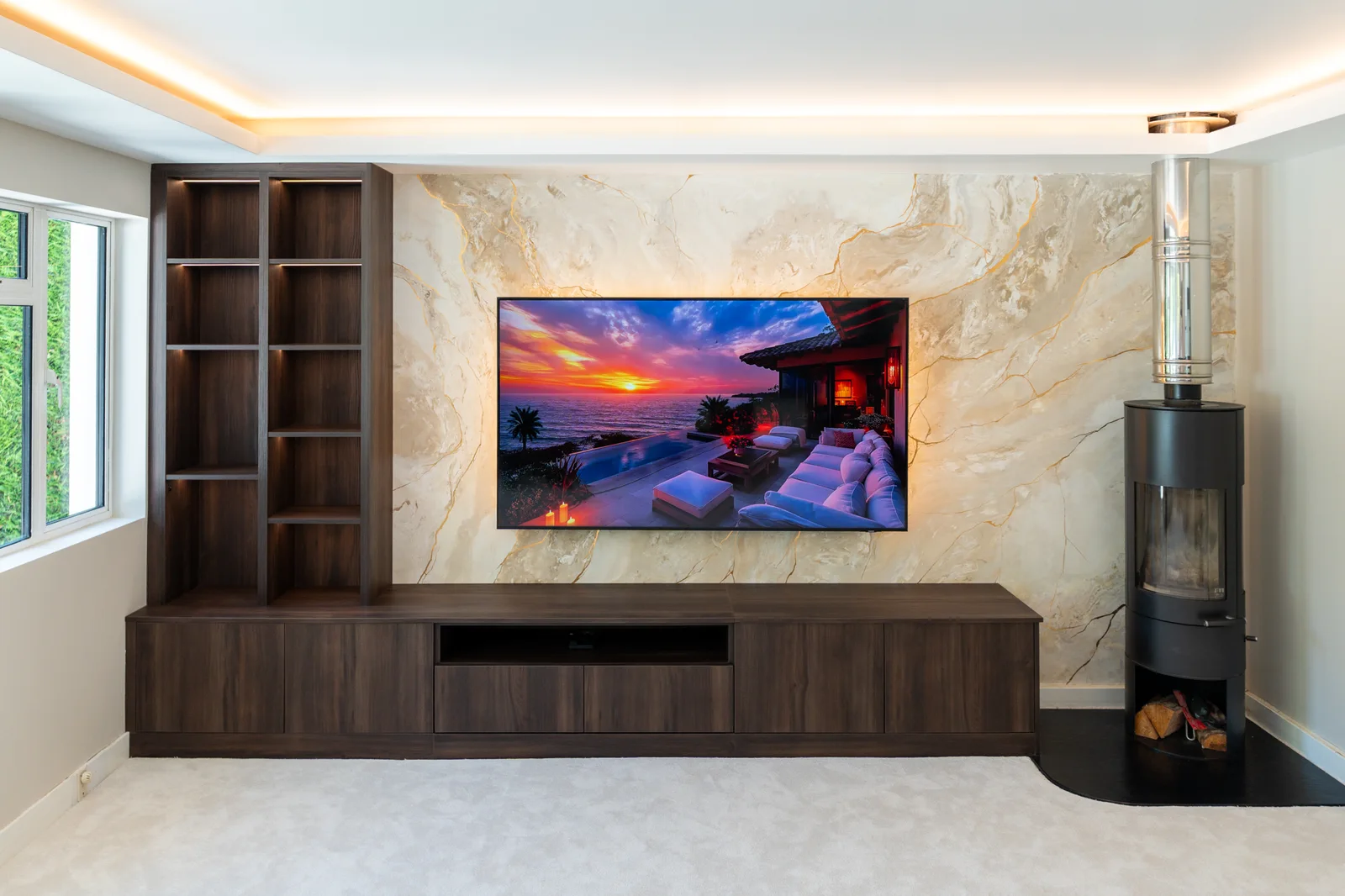 Pale television feature wall framed by dark timber cabinetry