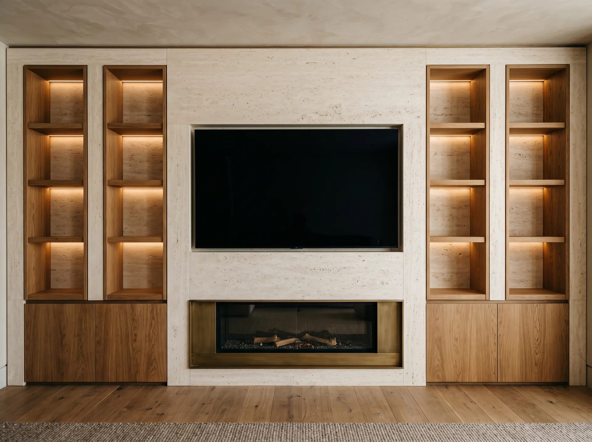Media wall concept combining travertine-style surfaces, timber cabinetry, recessed shelving and warm lighting