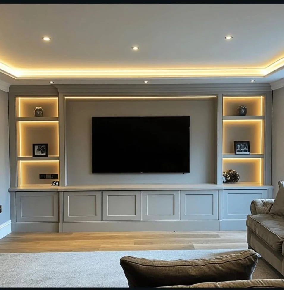 Full wall media unit with closed cupboard storage, TV recess and integrated LED lighting, Surrey