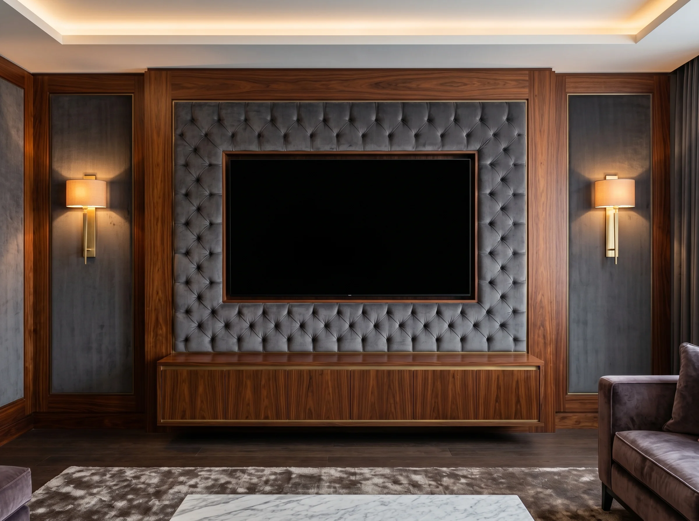 Bespoke media wall with velvet panel, walnut joinery and brass sconces designed by Daniel Brewster